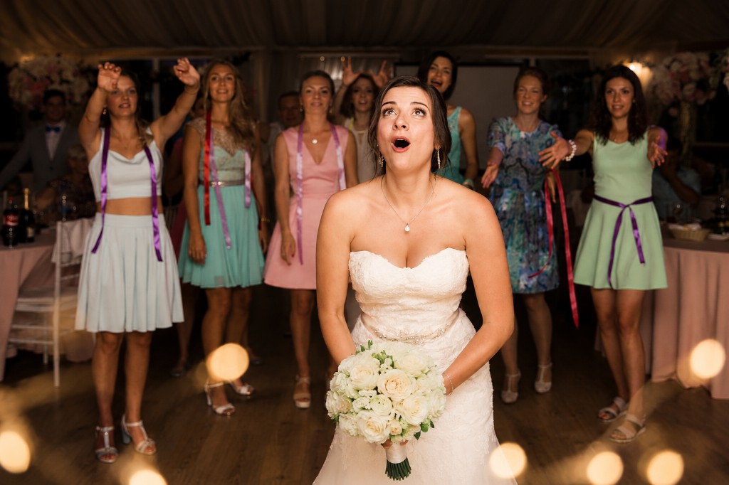 Julia tossing the bouquet at the reception